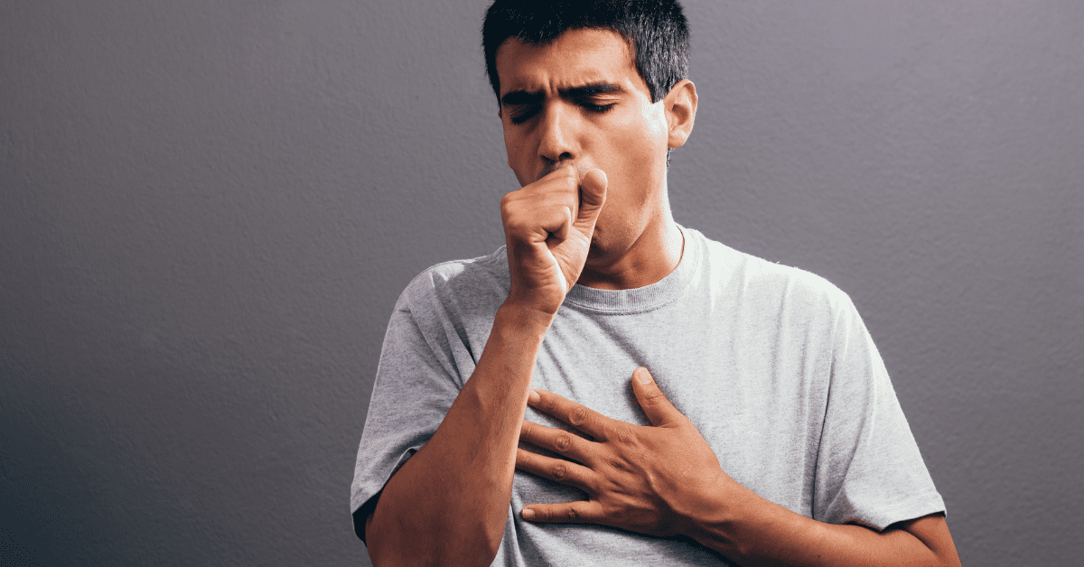 A man coughing with chest pain